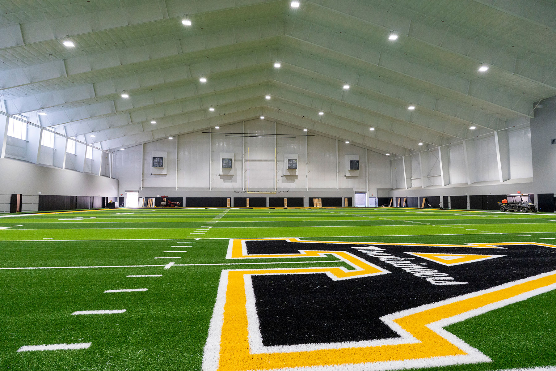 The new turf field that has been installed in the Sofield Family Indoor Practice Facility